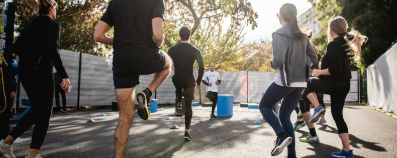 A group of people warming up for exercise