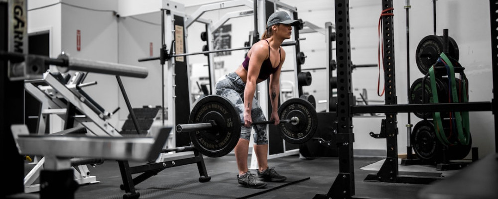 Woman performing deadlifts