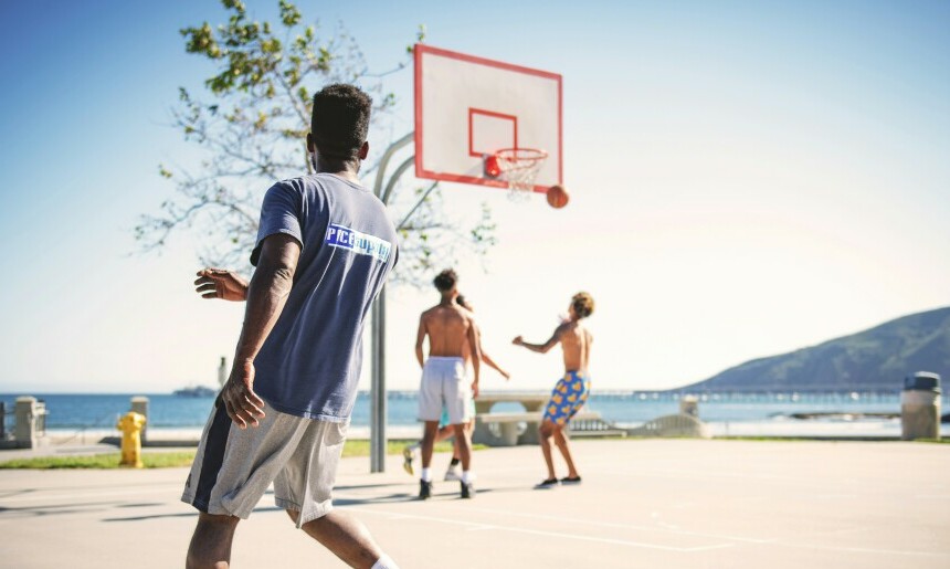 A group of guys playing basketball