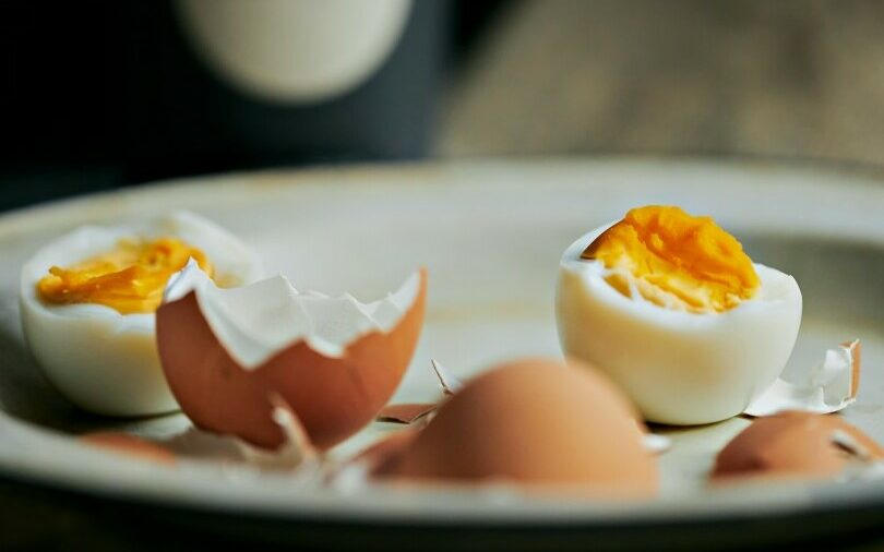 A boiled egg peeled and split in half