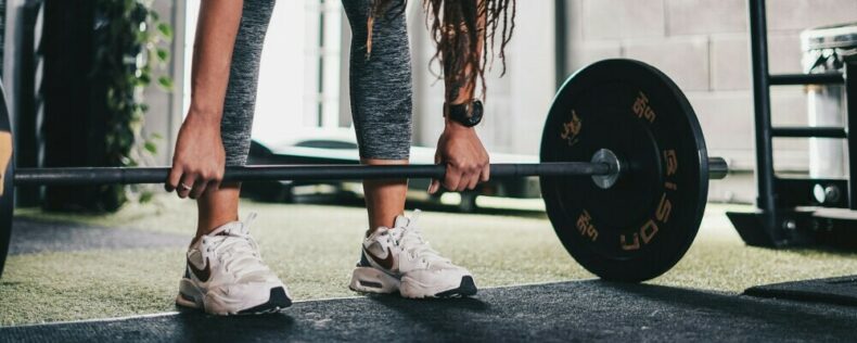 A person lifting a barbell